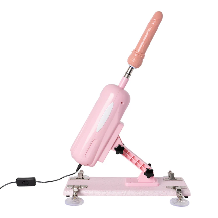 Máquina sexual Robbie en color rosado con dildo realista instalado sobre su base con ventosas.