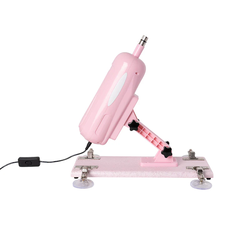 Máquina sexual Robbie en color rosado sin dildo conectado sobre su base con ventosas.