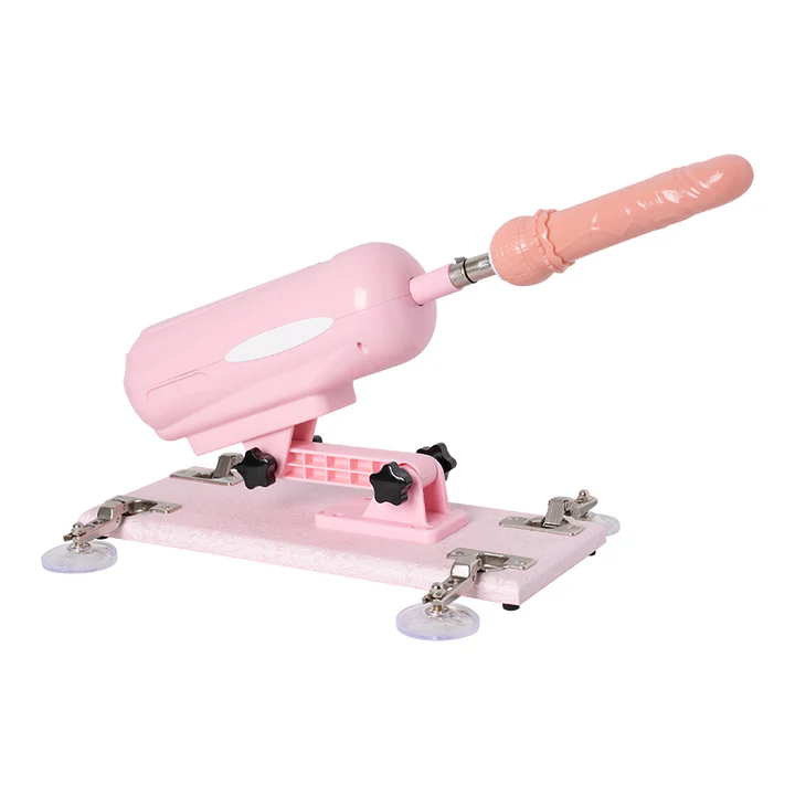Máquina sexual Robbie en color rosado inclinada lateralmente con dildo conectado.