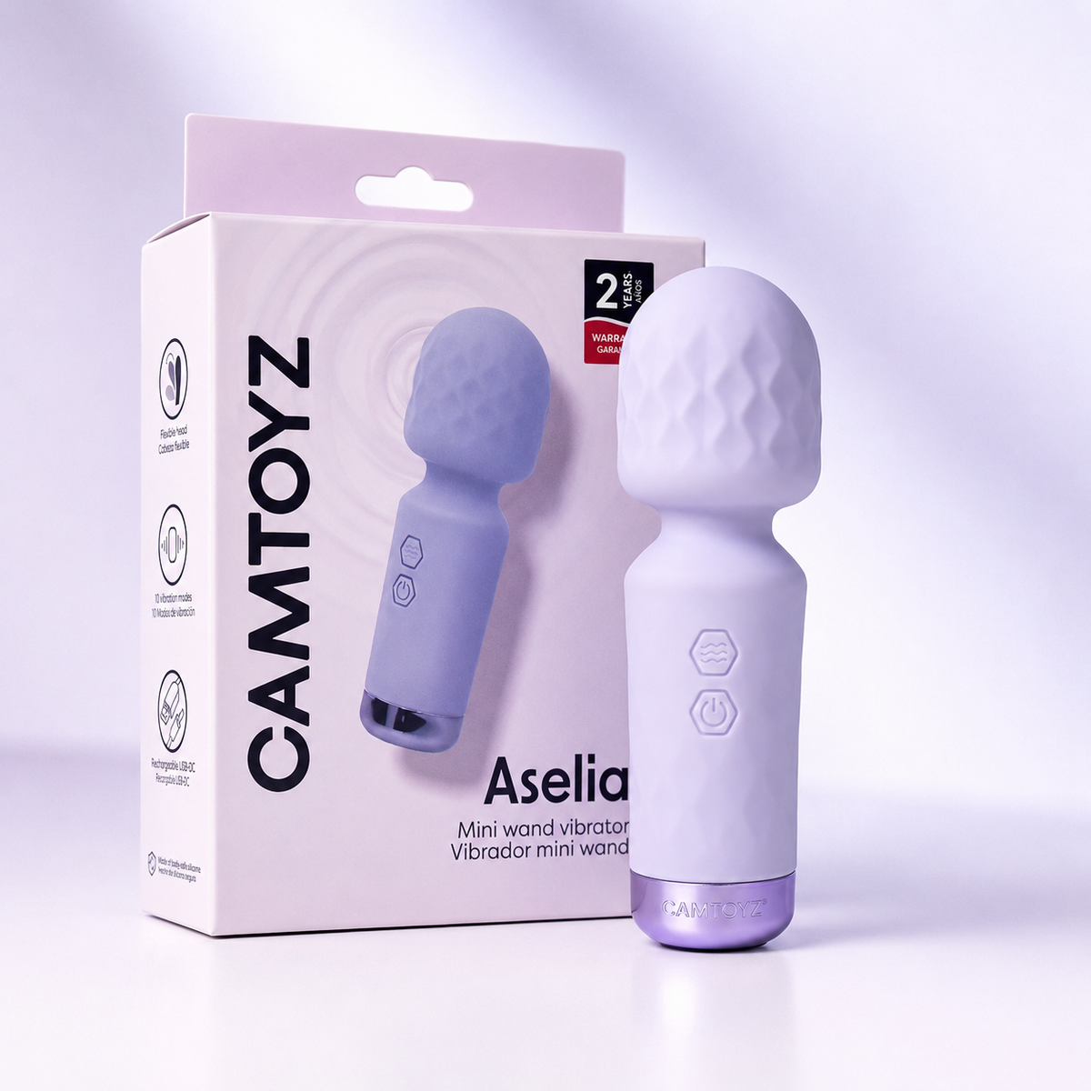 Vibrador Aselia Majestic morado con empaque y accesorio CamToyz sobre fondo de tela satinada